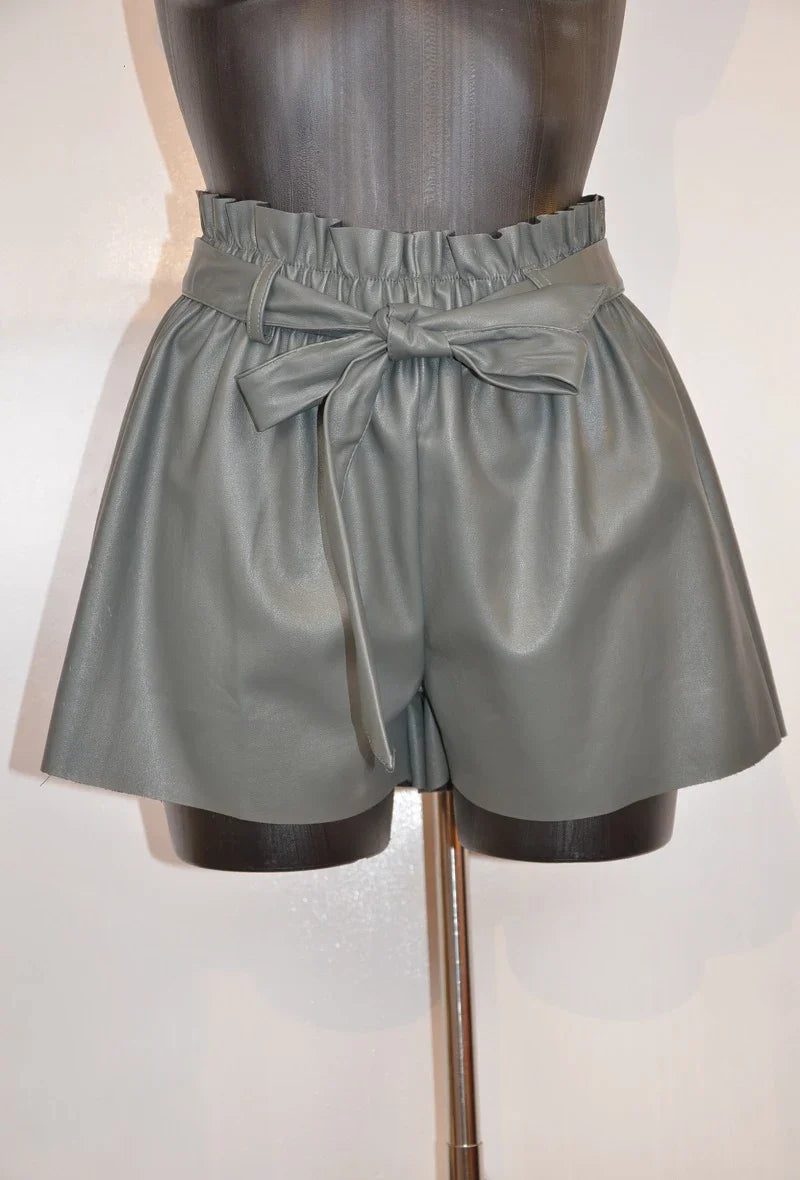 High-waisted faux leather shorts with tied belt